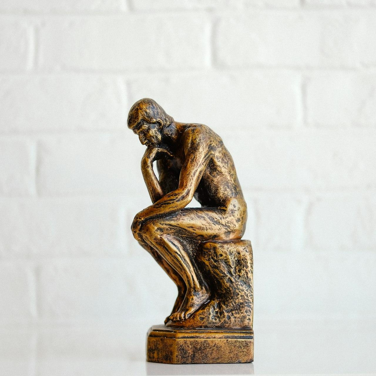 brown concrete statue of man